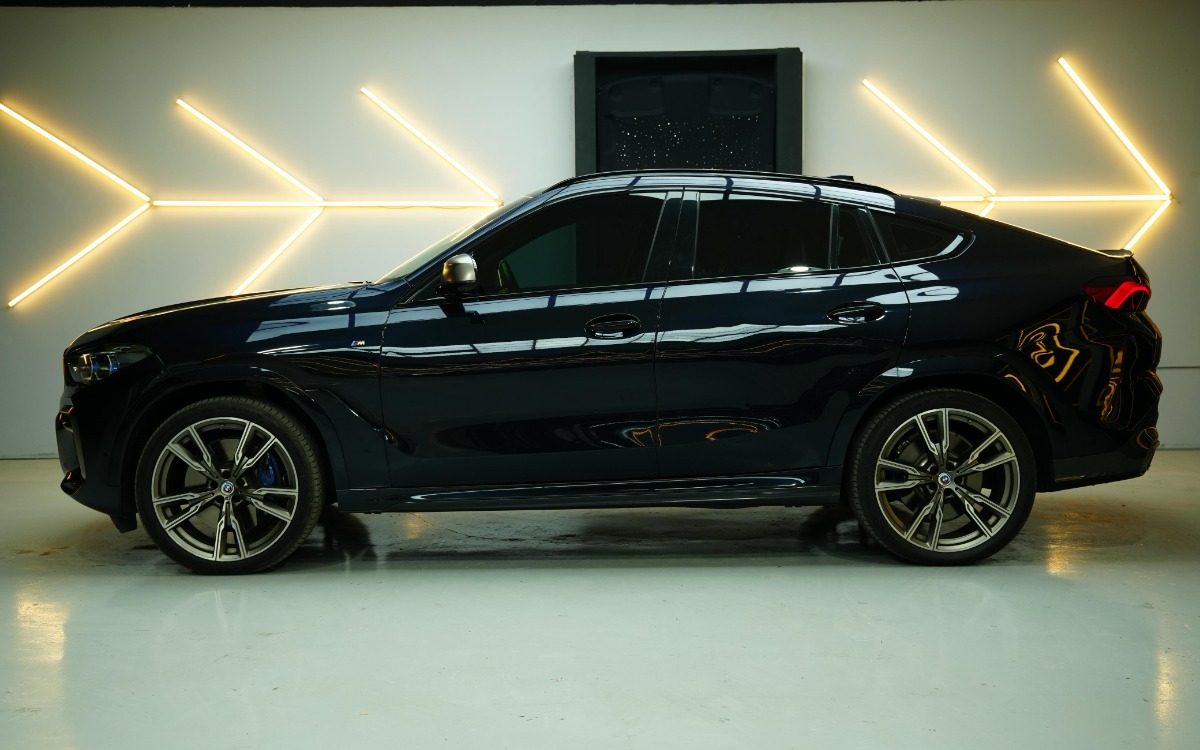 2024 BMW X6 M50i in Solid Black — gallery photo 3 in Dubai